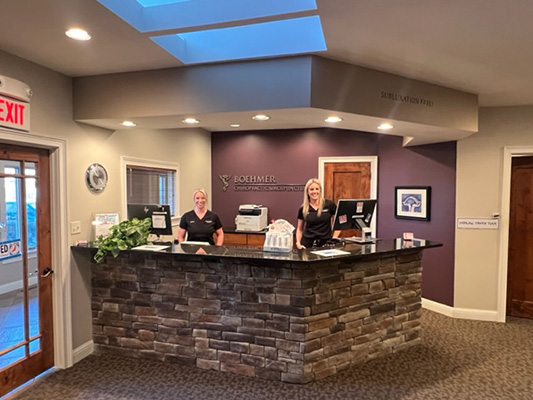 Chiropractic Columbia MO Alli & Melissa At Front Desk